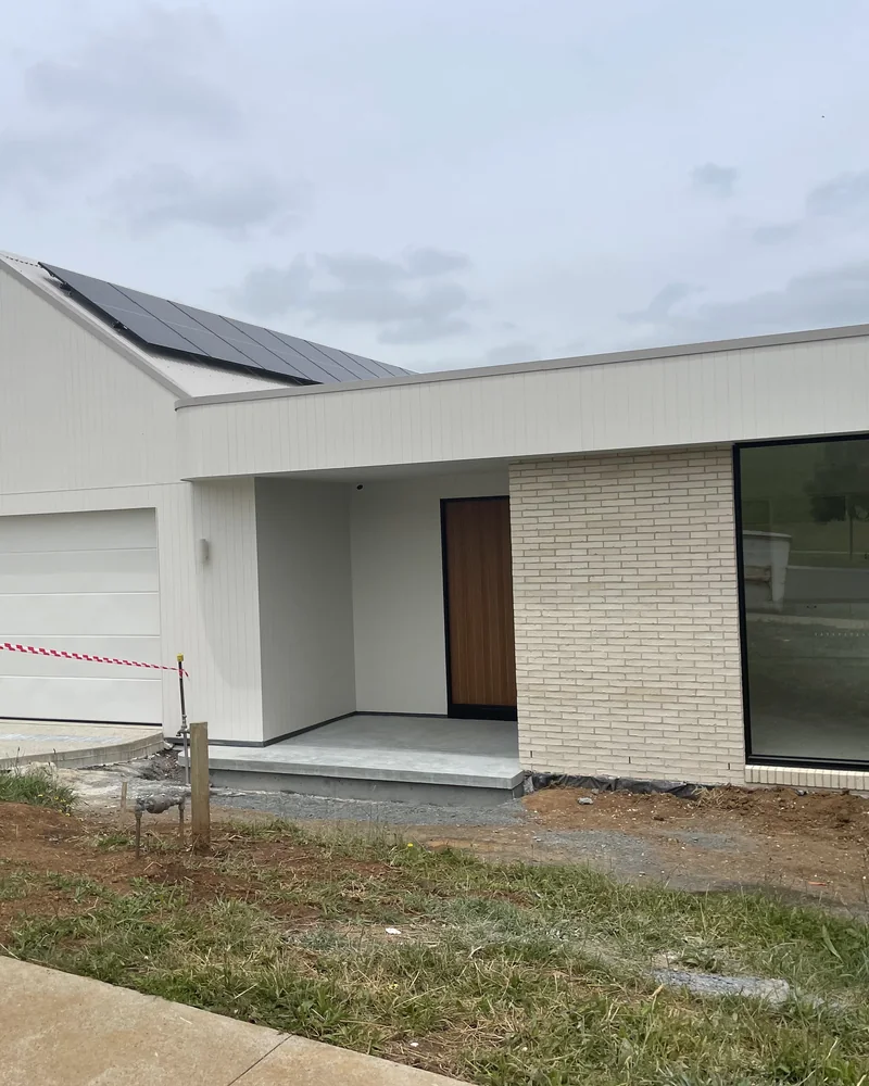 Newly completed metal roof on a recently built home